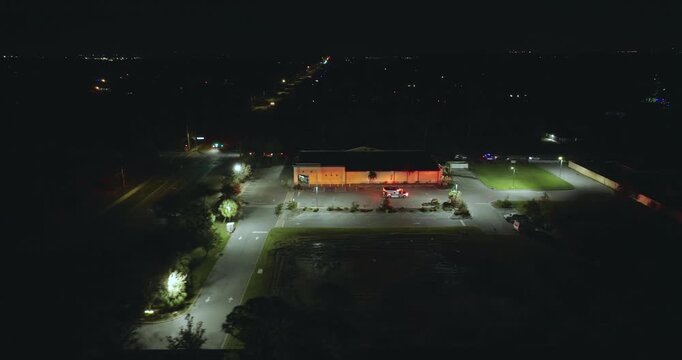Traffic crash with damaged cars on USA city street at night.