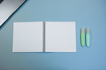 blank pages prepared for notes, student organizing schedule on tidy desk, spiral notebook paired...