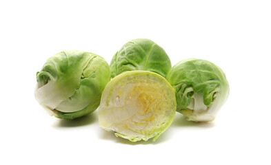 Fototapeta premium Half brussels sprouts raw isolated on white background, side view