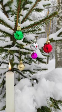 New Year's toys and a candle on the tree