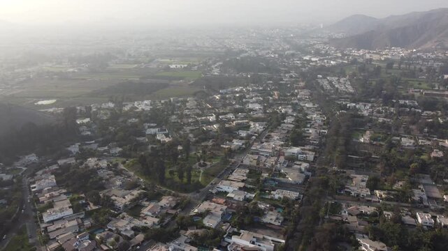 Aerial view of the residential district of la molina in lima, peru, with mountains in the background