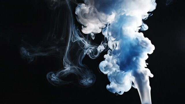 A cloud of white and blue smoke rises from the bottom, swirling and billowing upwards against a dark background, captured from a close-up viewpoint