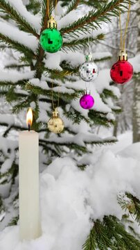 New Year's toys and a candle on the tree