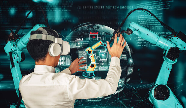 Engineer controls robotic arms by augmented reality industry technology application software. Smart robot machine in future factory working in concept of Industry 4.0 or 4th industrial revolution.