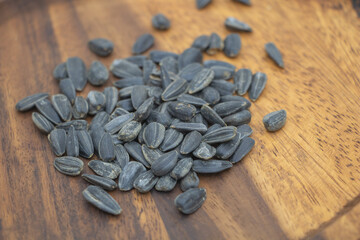 Sunflower Seeds on Wooden Table - Healthy Snack Background