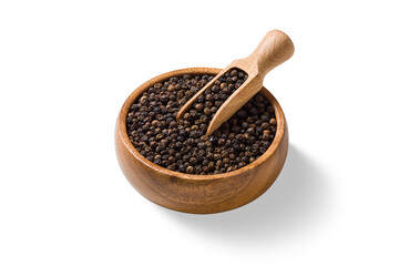 High angle view of black peppercorns in wooden bowl with scoop isolated on a transparent...