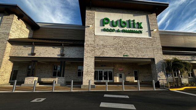 Publix Food and Pharmacy entrance with green sign and security bollards at 6605 38th Ave N on February 11, 2026 in St. Petersburg, Florida