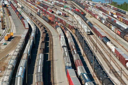 Canada, BC, Surrey.  CN Rail yard beneath the Port Mann Bridge.