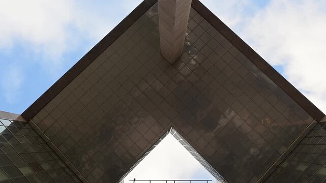 Looking up at the modern architectural facade of the Howard Kennedy LLP law firm headquarters at No 1 London Bridge featuring glass windows and sharp geometric lines