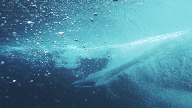 Smooth underwater wave line glowing turquoise with suspended bubbles and clean texture