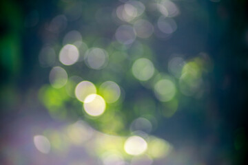 Obraz premium Soft Green Bokeh Light Background with Dreamy Natural Glow Abstract Nature Blur with Sparkling Sunlight Circles Fresh Spring Bokeh in Pastel Green and Blue Tones