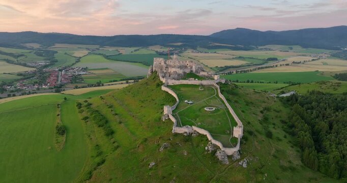 4K locked off hovering motion aerial drone view of the ruins of Spis Castle in eastern Slovakia, castle is situated above the town of Spisske Podhradie, UNESCO Heritage listed site, Spis, Slovakia