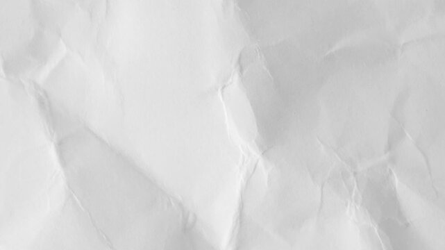 White crumpled paper background texture. Stop motion animation. Seamless looping.Close up of a crumpled piece of white paper showing texture and subtle shadows across the surface.