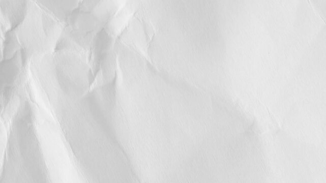 White crumpled paper background texture. Stop motion animation. Seamless looping.Close up of a crumpled piece of white paper showing texture and subtle shadows across the surface.