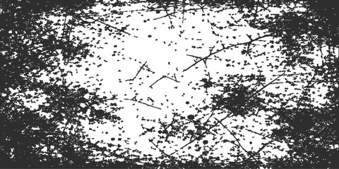 Fototapeta premium Abstract black and white grunge background featuring a vintage floral silhouette with ink splash textures and a dirty paint splatter border design