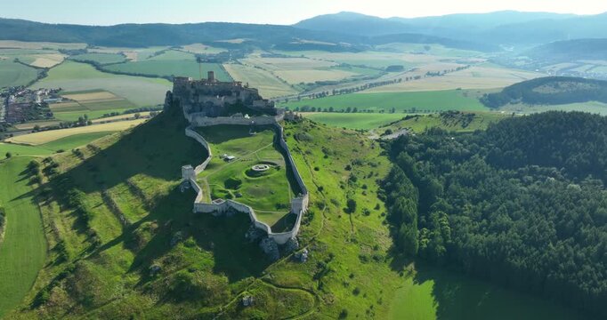 4K right to left panning aerial drone view of the ruins of Spis Castle in eastern Slovakia, the castle is situated above the town of Spisske Podhradie, UNESCO Heritage listed site, Spis, Slovakia