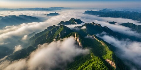 Cloud ocean over green mountain ridges