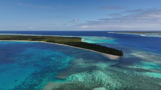 Drone fly around the tiny island of Eua, Kingdom of Tonga, capturing its full perimeter, lush palms, rugged coastline, and endless Pacific waters from a sweeping aerial perspective.