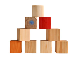 Obraz premium Stacked wooden blocks form a pyramid against black