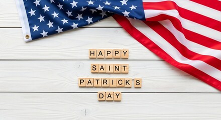 Fototapeta premium Wooden letter tiles spelling 'HAPPY SAINT PATRICK'S DAY' over a rustic white wood background with the American flag draped, ideal for St. Patrick's Day in Canada