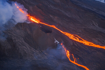 Close-up of active volcanic cone with glowing magma at the summit © yannis