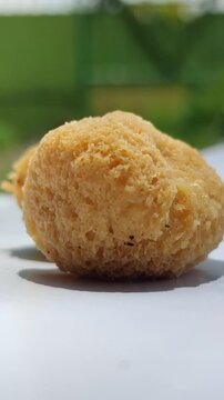 Tahu bulat, popular Indonesian street snack made from fried tofu balls, crispy outside and soft inside, freshly served as delicious local culinary food.