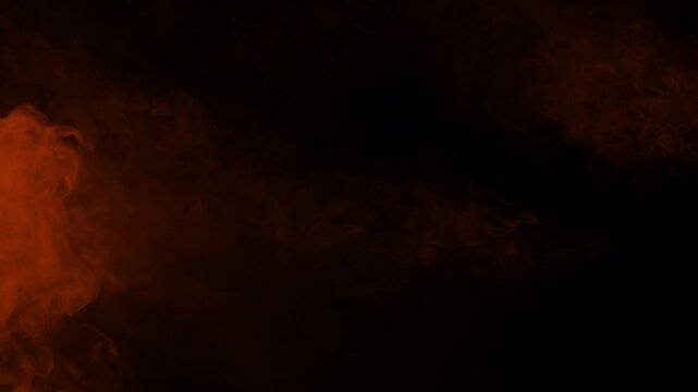 Stream of orange ember smoke flows horizontally from left to right. Isolated on black background, ideal for compositing, fire, exhaust, or atmospheric effects