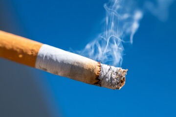 Smoke Forming and Dissolving from Tip of Cigarette Against Clear Sky