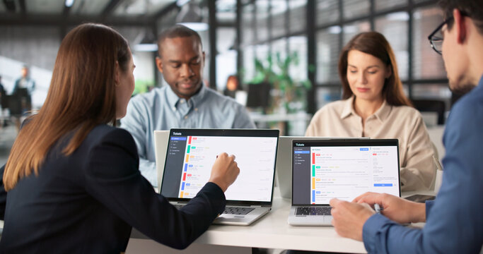 Multiracial Team Meeting To Discuss Support Tickets