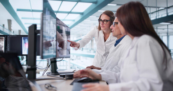 The Neurologist Carefully Examines The MRI Brain Scan On The Screen