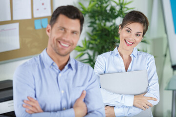 Obraz premium happy man and a woman in the office