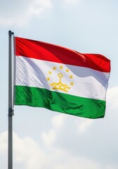 Fototapeta premium Tajikistan Flag Waving Under Clear Sky