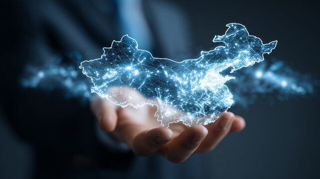 Businessman holding a glowing China map hologram for Asian market strategy and digital business expansion.