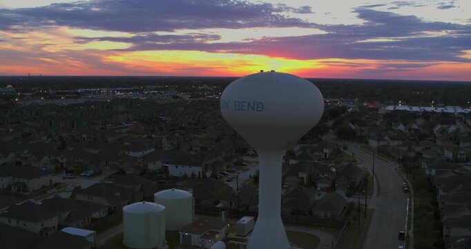 Smooth aerial drone footage of the Mission Bend residential neighborhood in west Houston, Texas, showing suburban homes and community layout in daylight