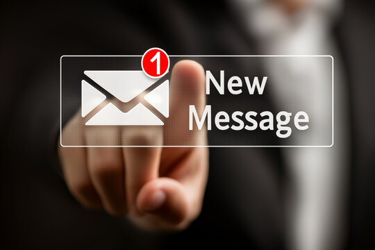 A businessman's hand presses the email notification icon with new message text on a digital interface, symbolizing instant communication, customer support, and online business messaging.