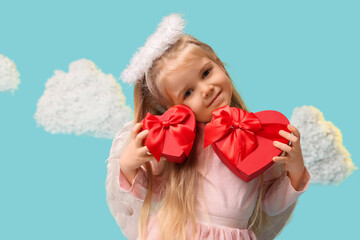 Cute little girl dressed as cupid with gift boxes and clouds on blue background. Valentine's Day celebration