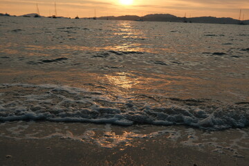 sunset at the beach with lower angle with waves 4