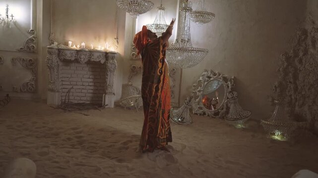 Fascinating ethnic dance performance, travel to Africa, enjoy unique culture. Save heritage and traditions of arabian world, beautiful female dancer dancing ritual dance for ask rain in desert