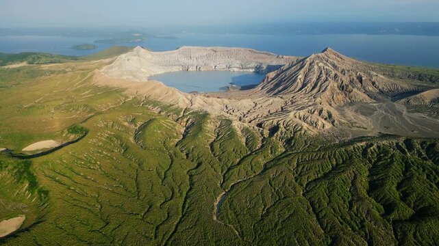 Smooth forward-moving drone shot approaching Taal Volcano, enhancing depth, motion, and immersive scale.