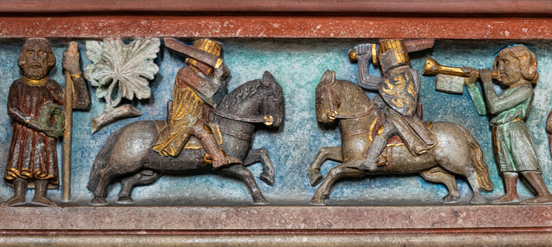 Knight's tournament. Medieval stone bas-relief, ancient interior decoration
