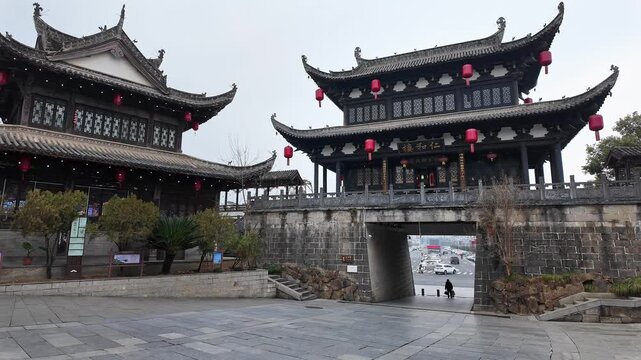 Huangshan, China: Panoramic footage of the entrance gate of the fortified wall with a temple in the Huizhou Ancient City dating from Ming dynasty in Anhui in China
