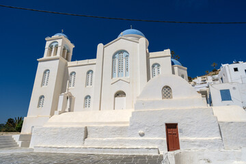 View of a beautiful whitewashed orthodox cathedral in Ios Greece