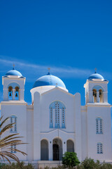 View of a beautiful whitewashed orthodox cathedral in Ios Greece