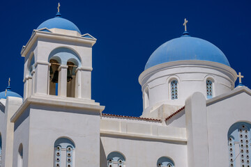 View of a beautiful whitewashed orthodox cathedral in Ios Greece
