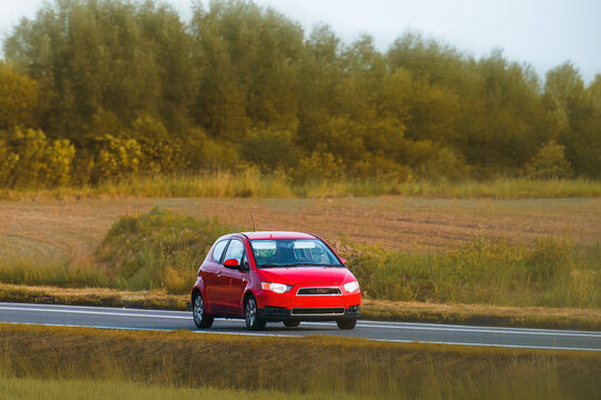 Turbocharged hatchback driving along country road