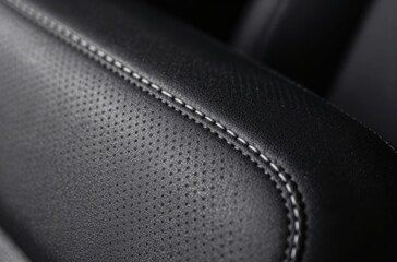 Close-up of Black Leather Car Seat with White Stitching Detail Showcasing Luxury and Craftsmanship