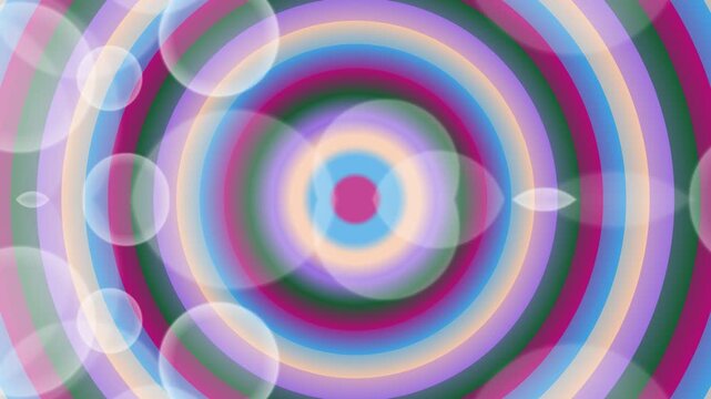 A vibrant, multicolored circular pattern with concentric rings and overlapping transparent circles on a white background