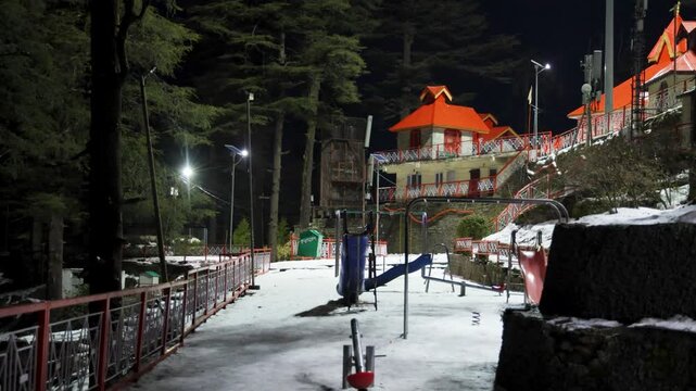 snow covered temple complex with empty playground at night in hill station video is taken at Shree Hanuman Temple, Jakhu, Shimla himachal pradesh india.