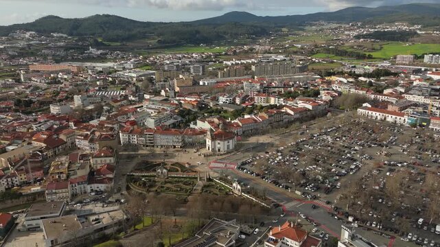 Aerial view of Barcelos city center showing church square roads cars and buildings