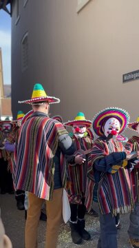 Traditional annual carnival in Switzerland. Carnival of the expulsion of winter and greeting of spring. Children's Carnival in Sissach of the Canton of Basel - Land.